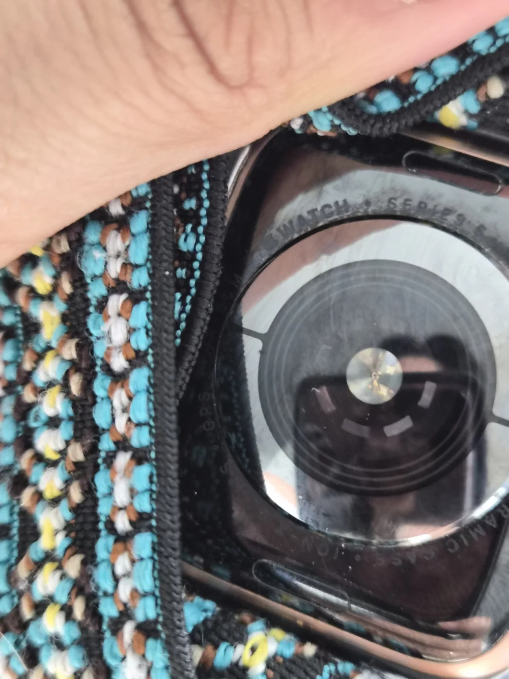 Apple Smartwatch with Black Case and Teal Patterned Woven Band